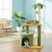 Cat on 37-inch coconut palm cat tree with green leaves